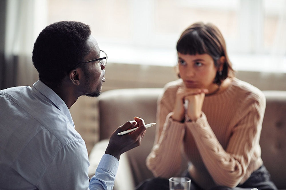therapist discussing addiction with patient