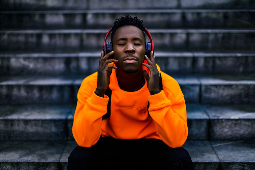man wearing headphones listening to music to cope with anxiety
