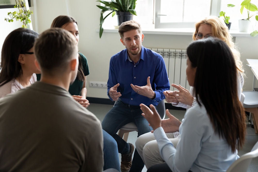 Addiction support group comprised of six members of various genders and races
