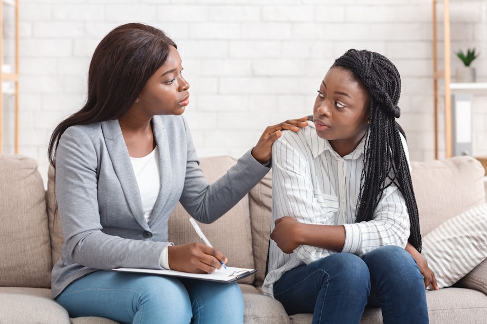 gateway-drugs Therapist in blazer explaining gateway drugs to teenager with box braids